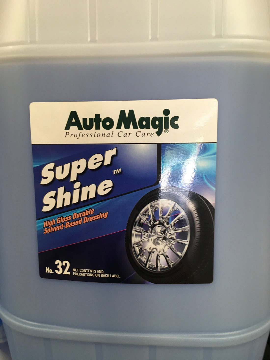 AutoMagic Super Shine 5 Gal high gloss solvent-based dressing for exterior surfaces.